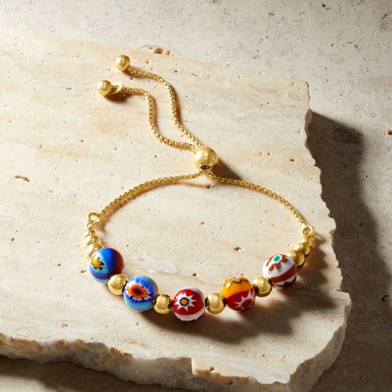 Multicolor Murano glass bead bolo bracelet with gold-tone wire and adjustable ends