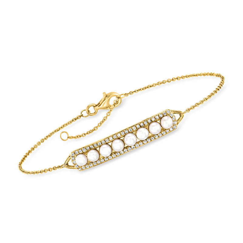 Gold bracelet with bar clasp, oval white topaz row and small cultured pearl accents