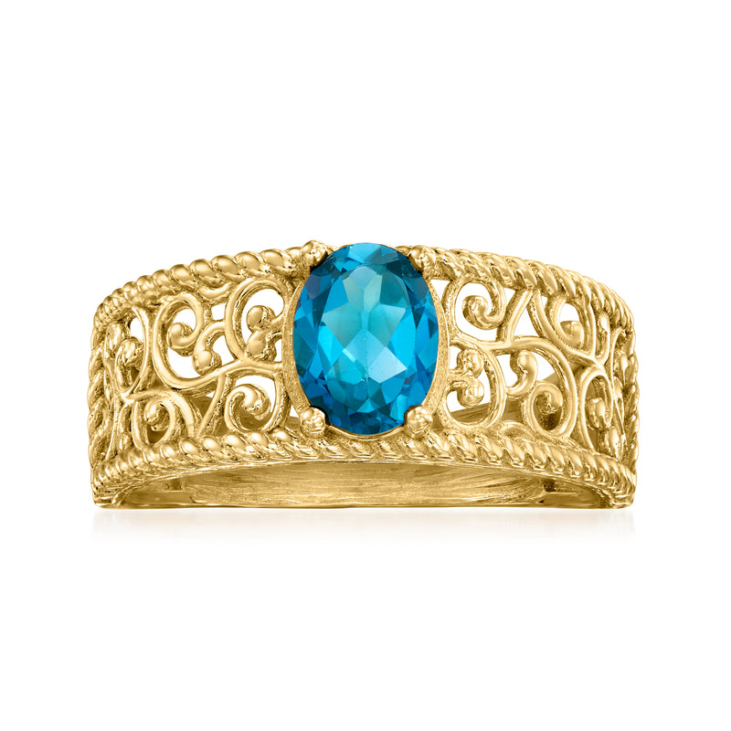Gold-tone scrollwork ring with oval London blue topaz gemstone center
