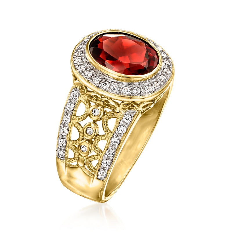 Gold filigree ring with oval red garnet and bright white zircon border