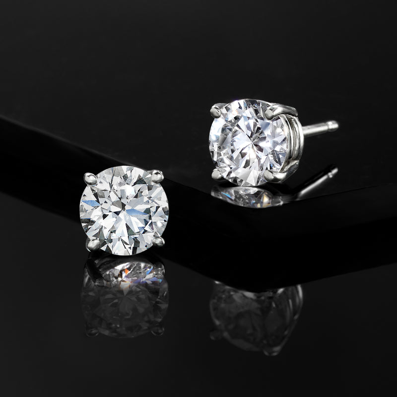 White gold lab-grown diamond stud earrings with round stones and prong backs