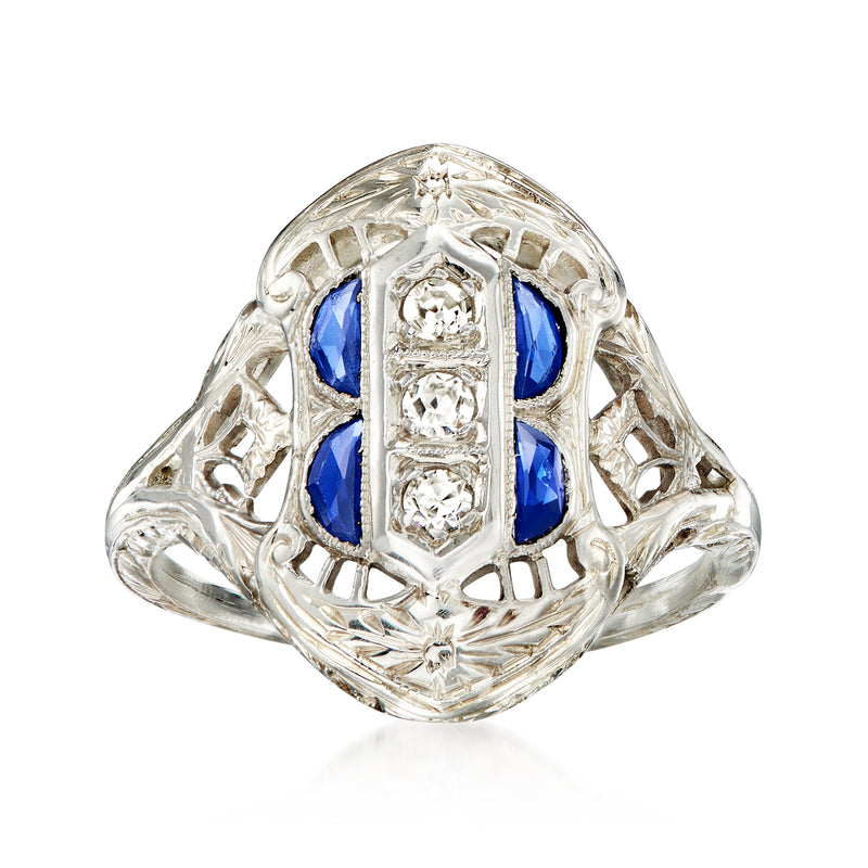 Vintage white gold filigree ring with oval blue sapphire and diamond accents