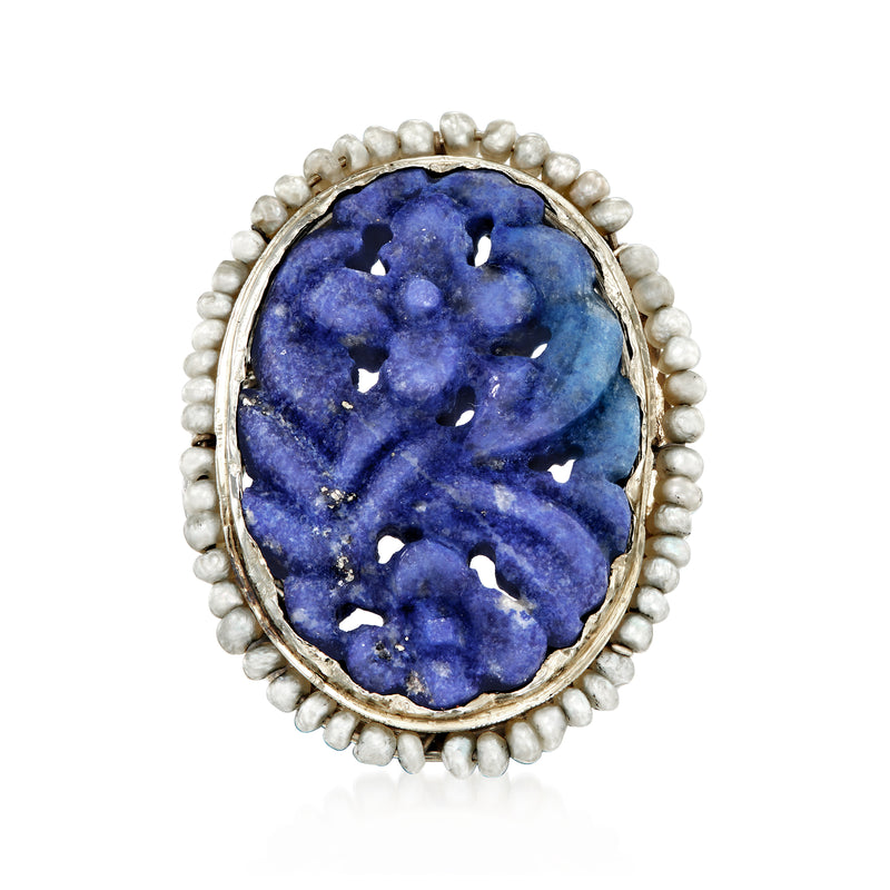 Oval blue carved lapis ring with seed pearl halo in 18kt white gold