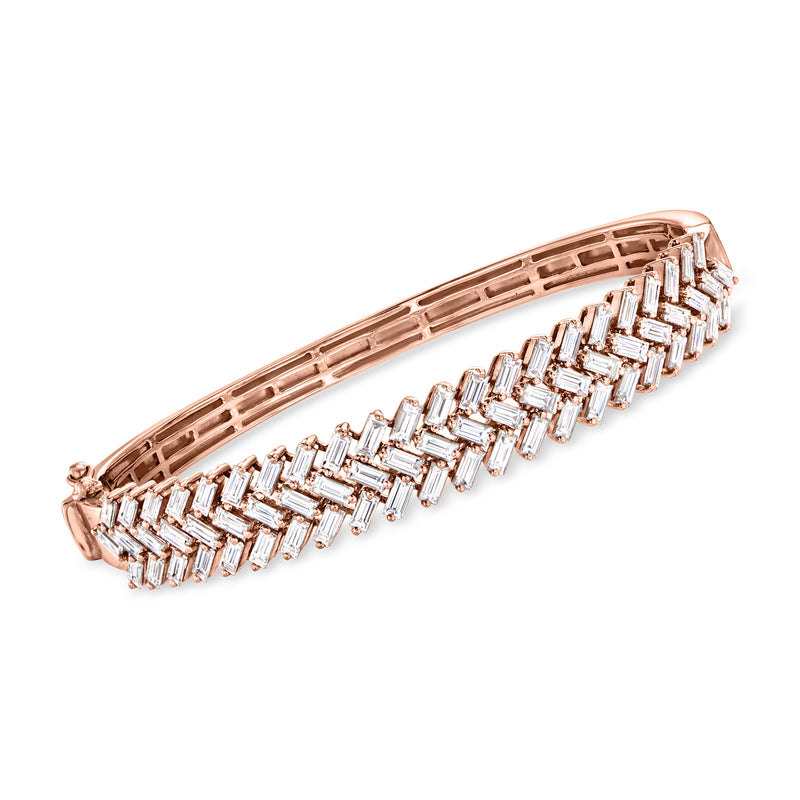 18kt rose gold diamond zigzag bangle with baguette-cut stones, hinged bracelet.