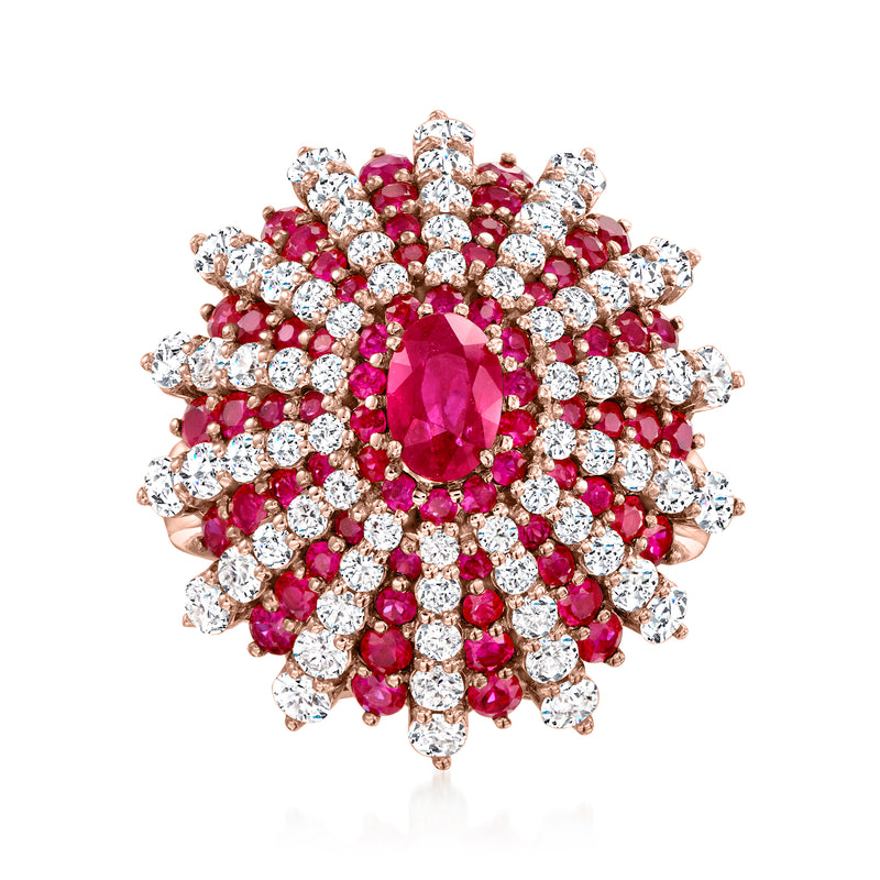 18kt rose gold starburst ring with oval ruby center and diamond accents