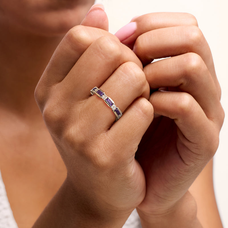 Amethyst and white zircon eternity band on finger, 18kt gold over sterling, purple stones