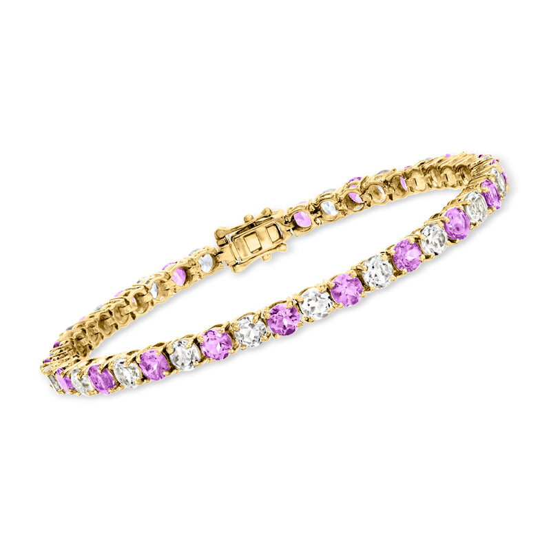 Gold-tone tennis bracelet with amethyst-purple and clear white stones, linked metal design