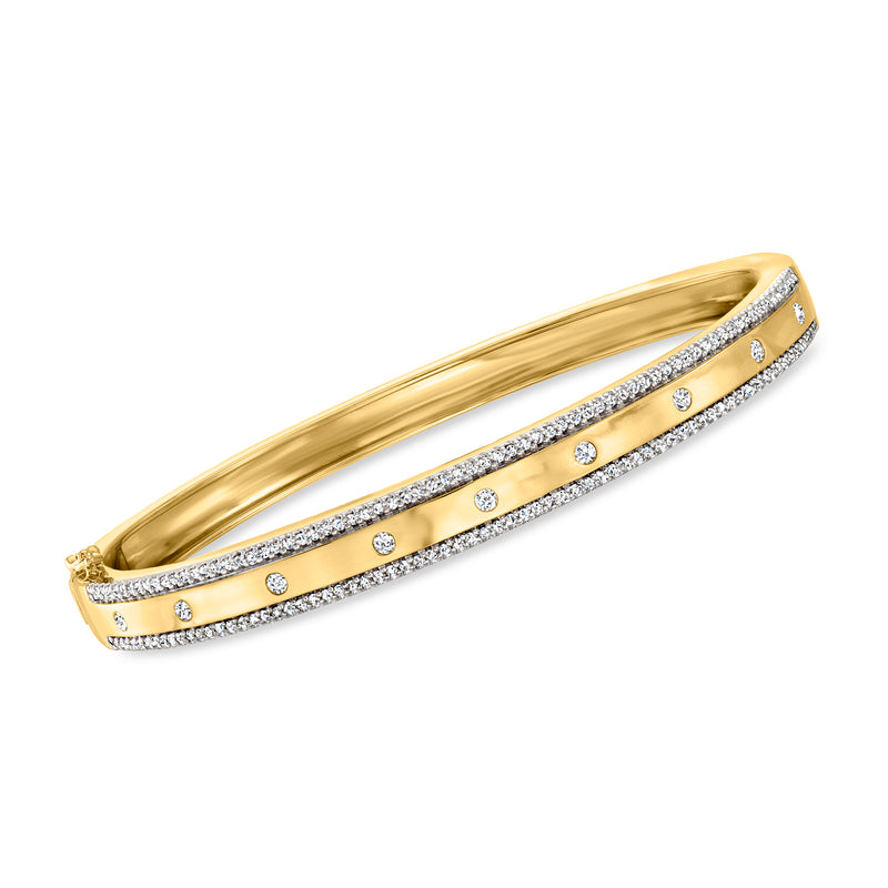Gold-tone diamond-studded bangle bracelet with round stones and pave ribbon.