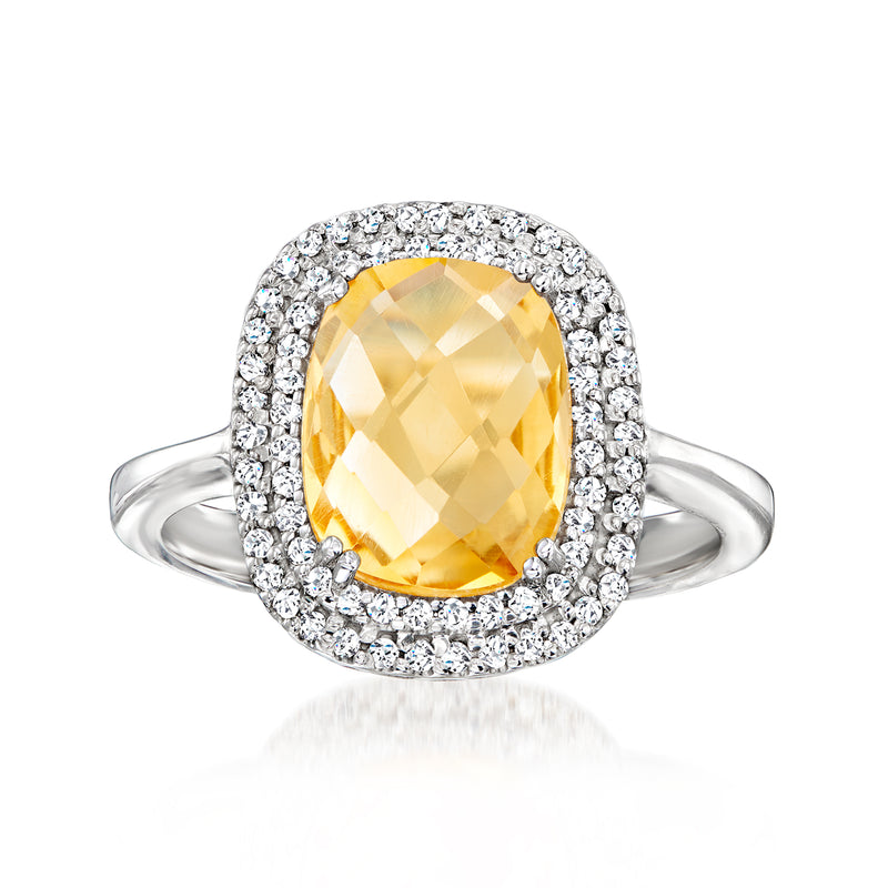 Citrine and diamond halo ring in 14kt white gold with oval yellow center stone