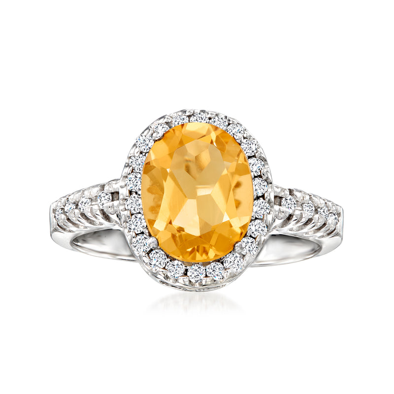 Oval citrine and diamond halo ring in 14kt white gold with slim band
