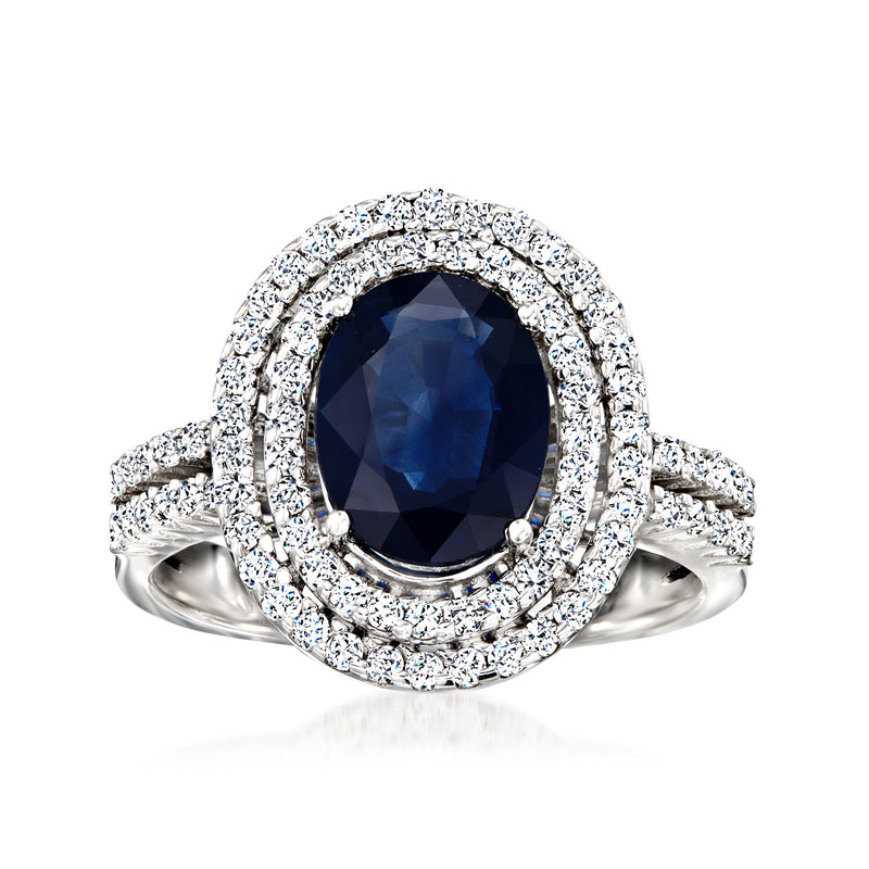 14kt white gold ring with dark blue oval sapphire center and diamond halo