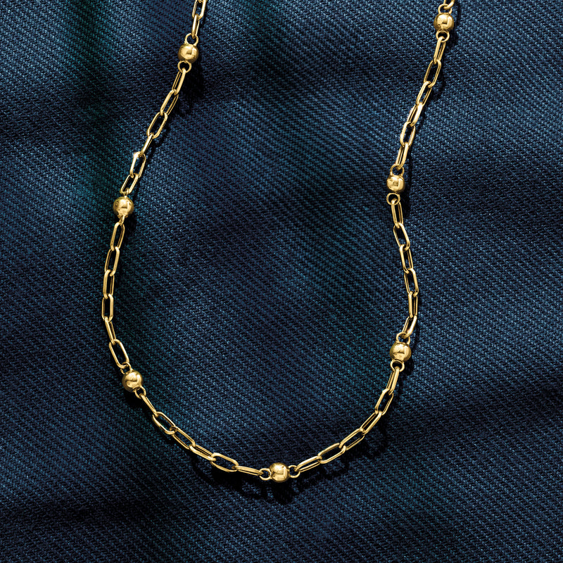 18kt yellow gold paper clip link necklace close-up with bead stations