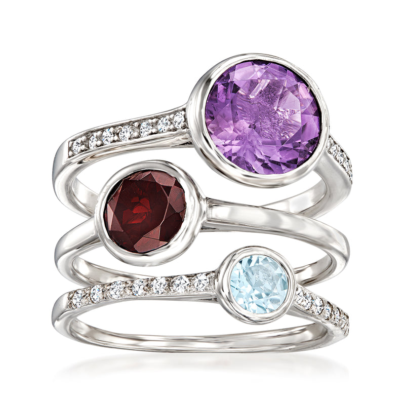 Three-ring sterling silver set with round purple, red, and light blue gemstones