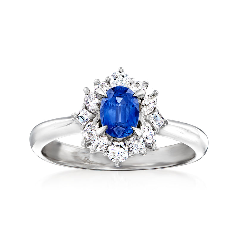 Platinum vintage ring with blue sapphire center and diamond halo with side stones
