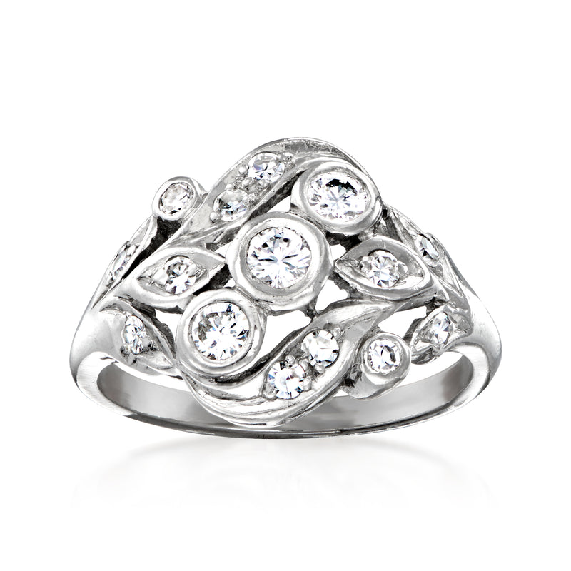 Vintage platinum diamond cocktail ring with round bezel-set stones