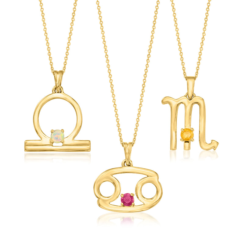 Gemstone zodiac pendant necklace, gold-tone circular symbol with light blue stone