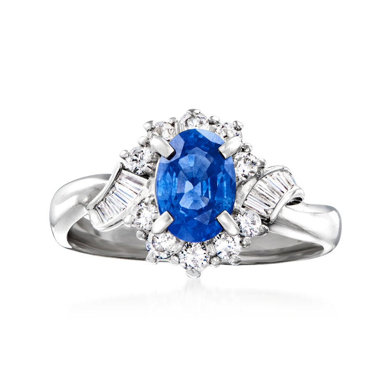 Vintage platinum ring with oval blue sapphire center and diamond halo and side accents
