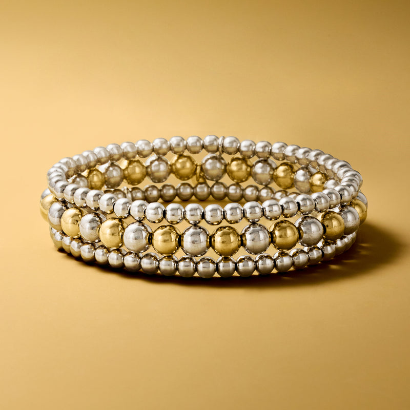 Three two-tone bead stretch bracelets with silver and gold-tone bead rows