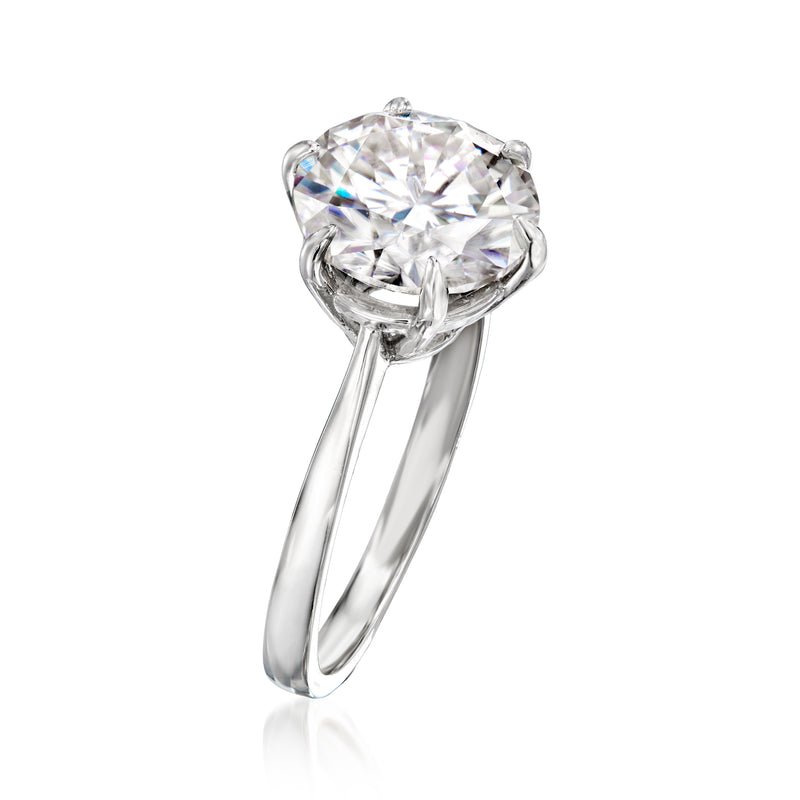Sterling silver solitaire ring with round moissanite center, four-prong setting