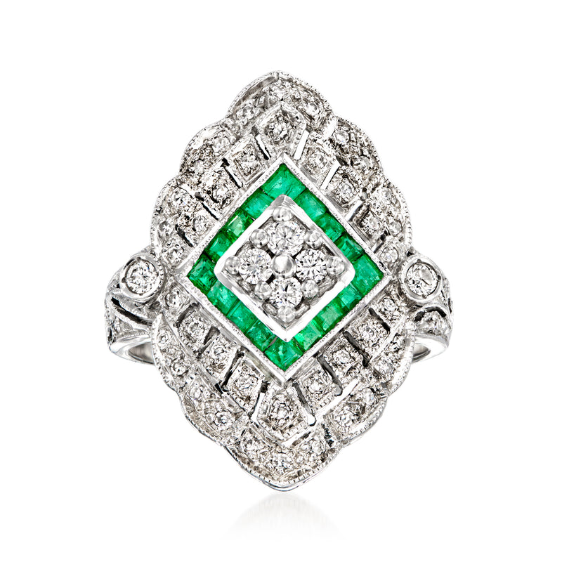 Vintage white gold filigree ring with emerald green center and diamond halo accents