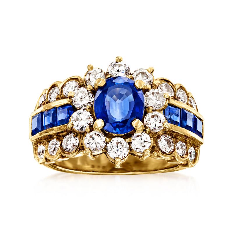 18kt yellow gold cocktail ring with oval blue sapphire center and round diamond halo