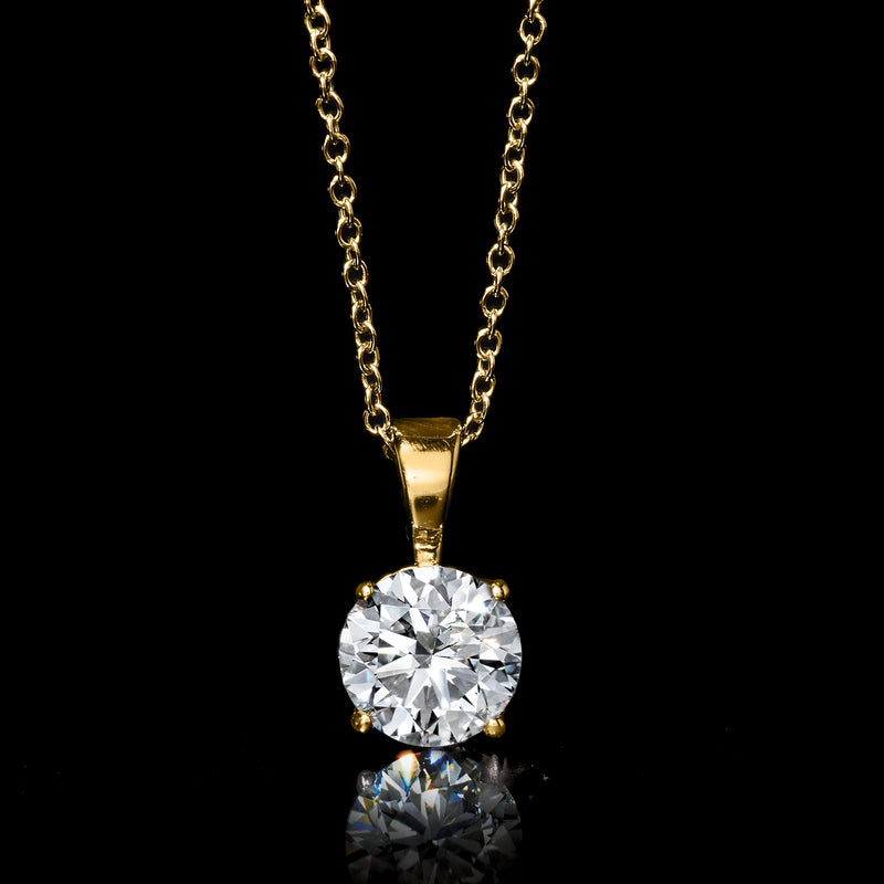 Round diamond solitaire pendant in 14kt yellow gold on gold chain