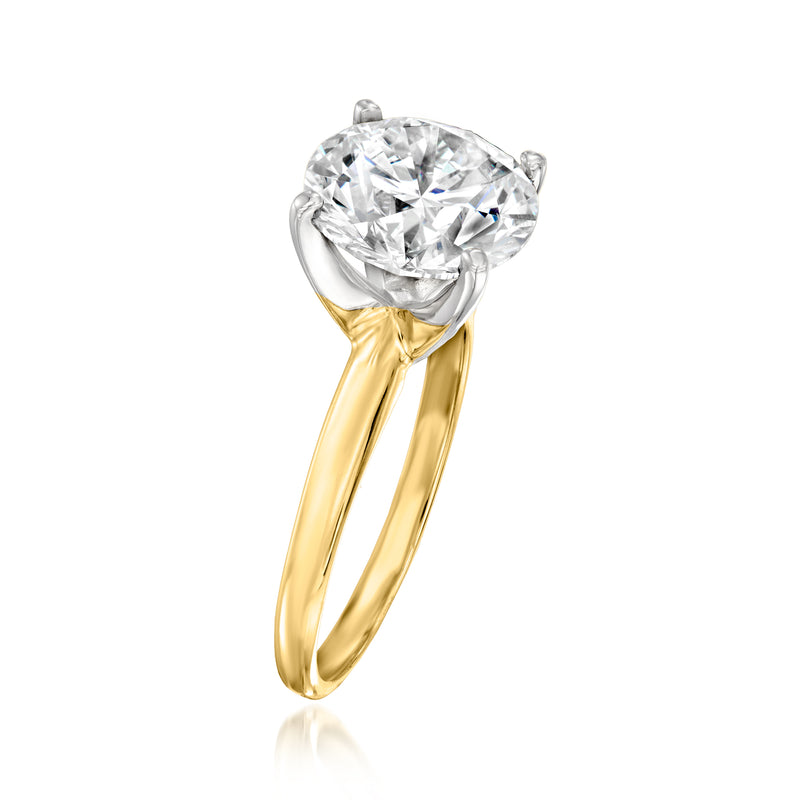 14kt yellow gold solitaire diamond ring, round center stone in four-prong setting