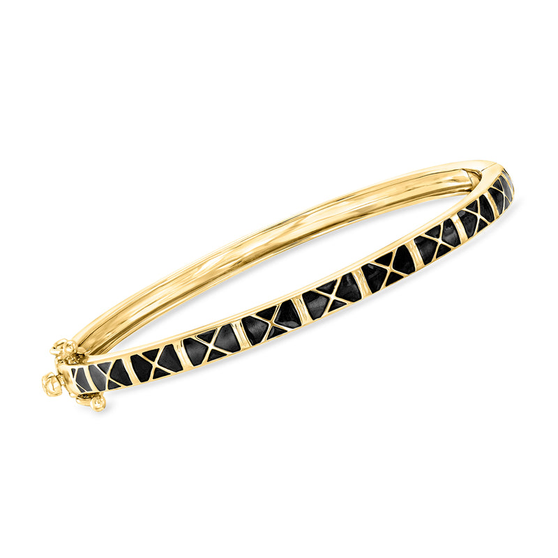 Gold-tone hinged bangle bracelet with black enamel X pattern and hinge clasp