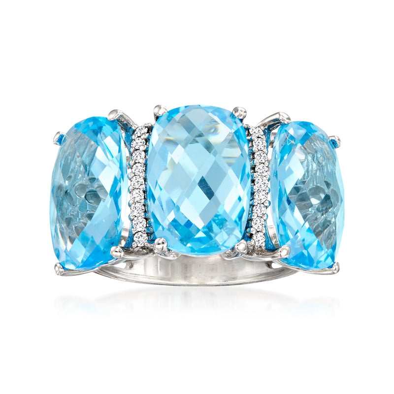 14kt white gold ring with oval Swiss blue topaz center and diamond accents, blue side stones