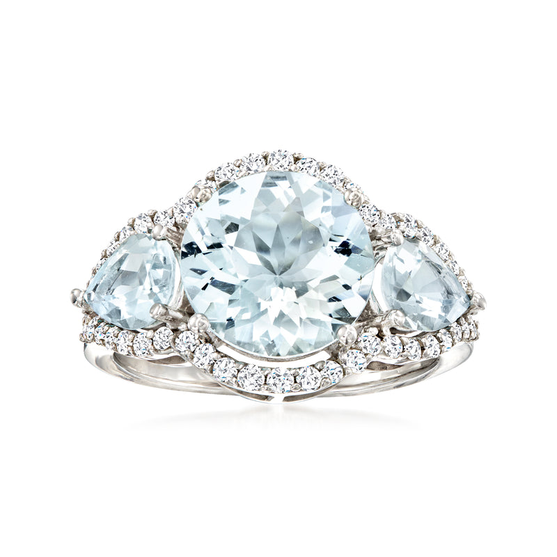 14kt white gold three-stone ring with oval aquamarine center and diamond sides