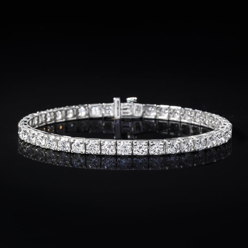 Diamond tennis bracelet with round-cut stones and center clasp link, side view