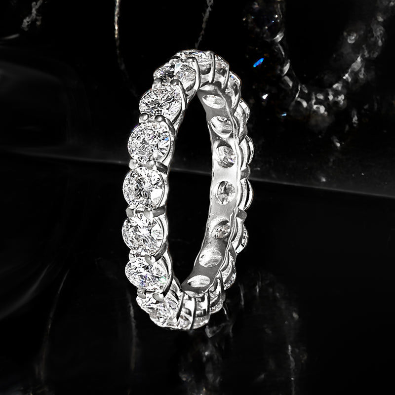 14kt white gold diamond eternity band with round stones and prong settings