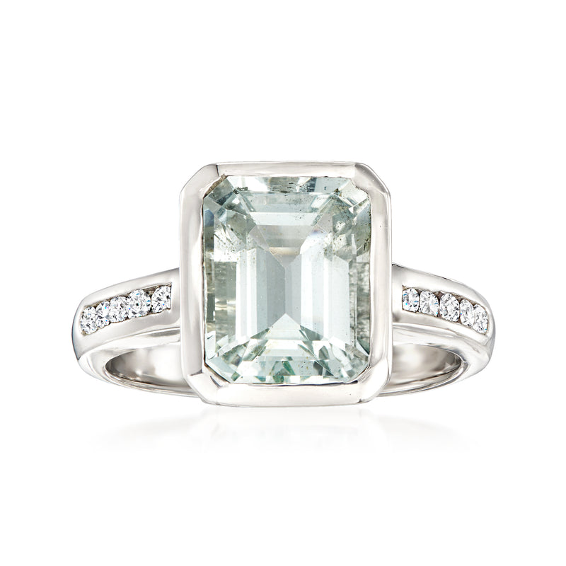 14kt white gold ring with emerald-cut aquamarine center and diamond side stones