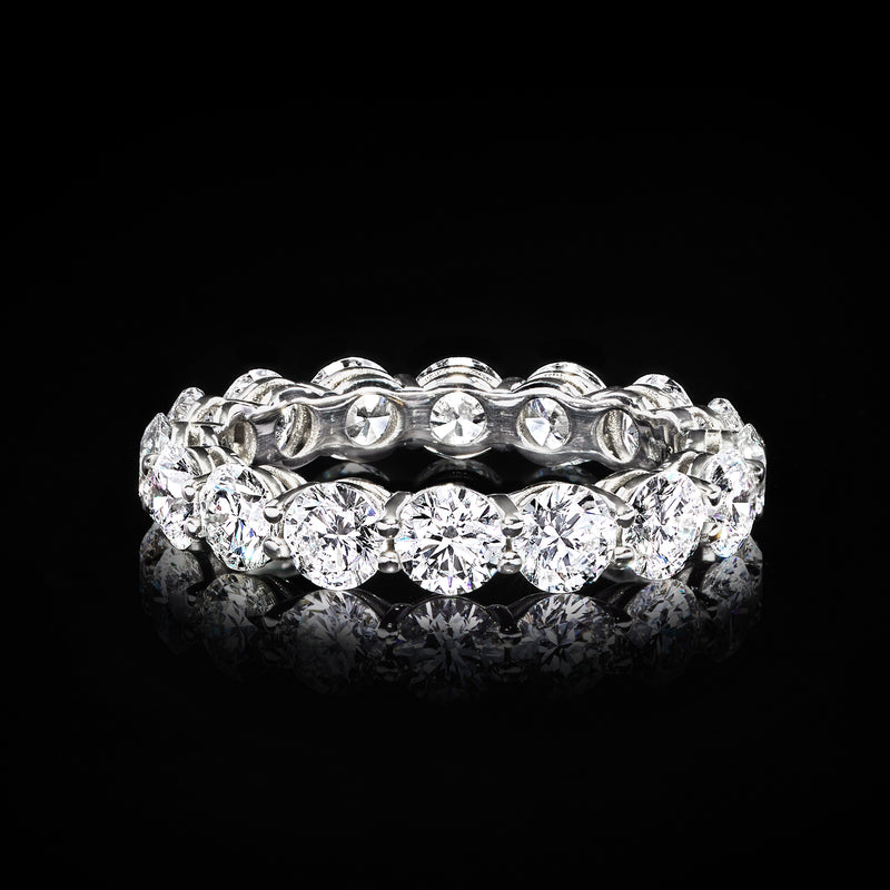 Diamond eternity band in polished 14kt white gold with continuous round stones