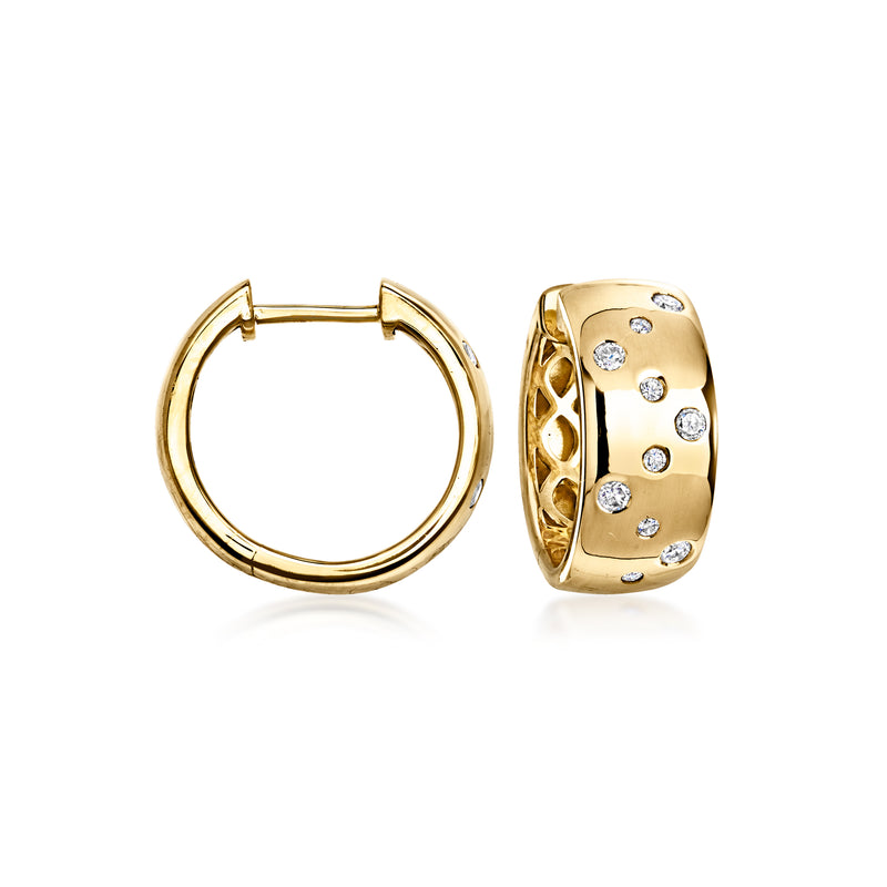 Gold hoop earrings with diamond-dotted zigzag band, hinged closure