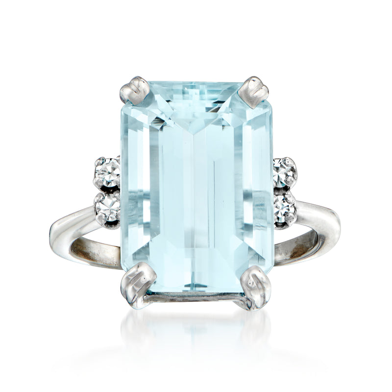 Aquamarine emerald-cut ring in white gold with four-prong setting and small side diamonds