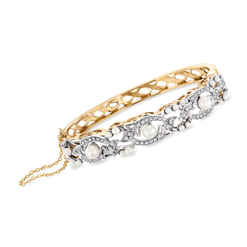 Two-tone gold bangle bracelet with cultured pearl drops and diamond-like accents