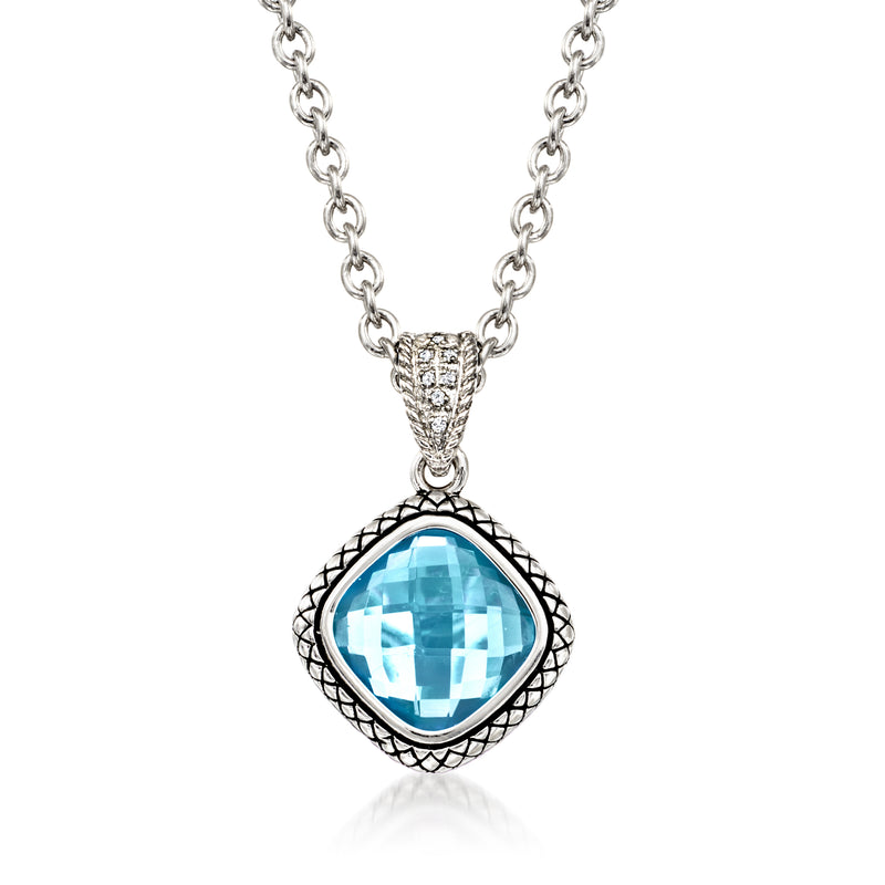 Sterling silver pendant necklace with blue topaz center stone and diamond accents