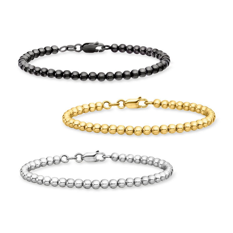 Three beaded bracelets set with black, gold, and silver round bead chains