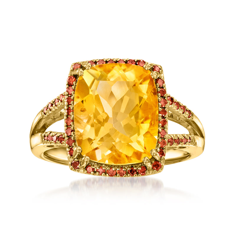 Gold ring with oval yellow citrine center and red gemstone halo, prong-set