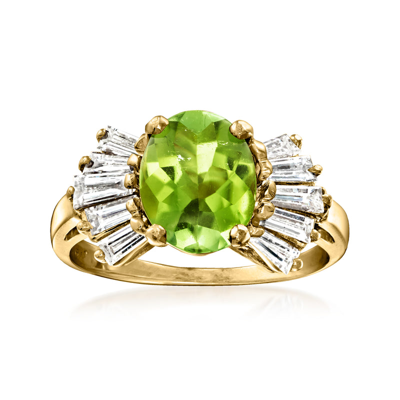Vintage yellow gold ring with oval green tourmaline center and baguette diamond side stones