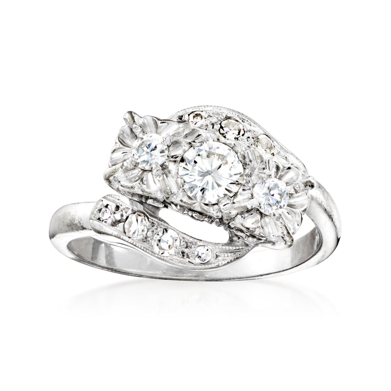 Vintage bypass diamond ring in 14kt white gold, round center stone with side diamonds