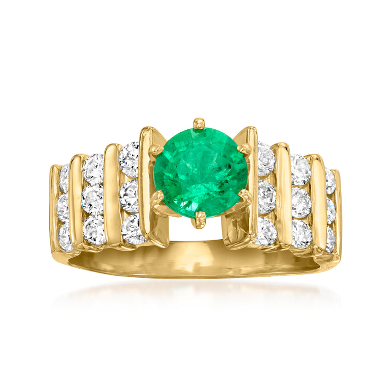 14kt yellow gold ring with oval emerald center and round diamond side stones