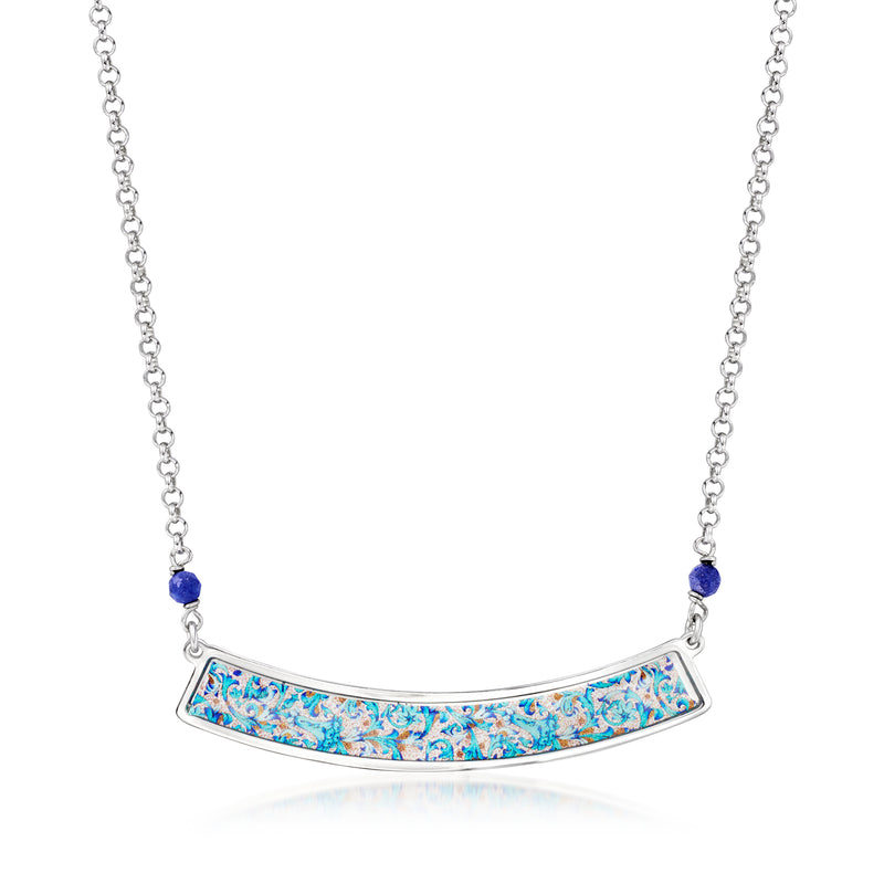 Sterling silver necklace with blue lapis bead and arched bar pendant in mosaic pattern