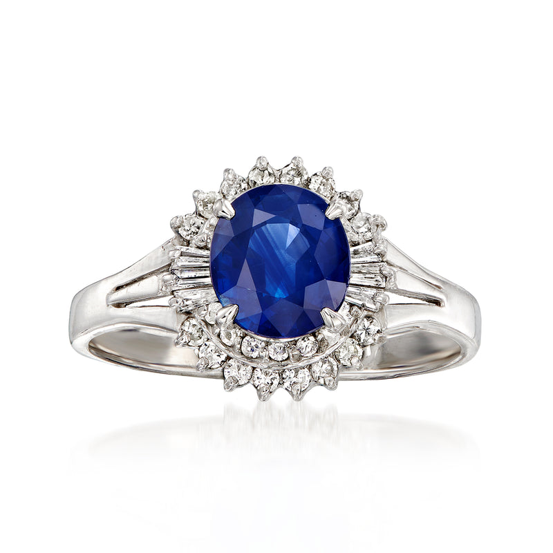 Platinum ring with oval blue sapphire center and diamond halo, vintage style