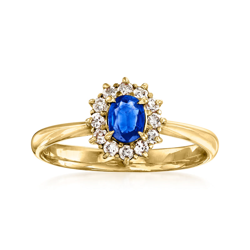 18k yellow gold sapphire and diamond halo ring with oval blue stone