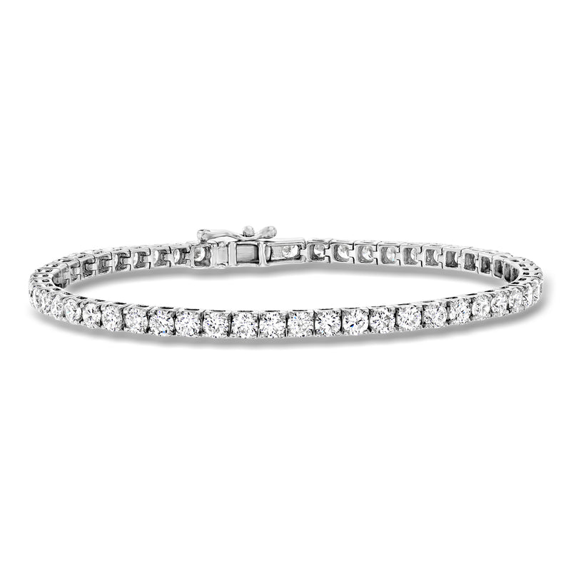 Diamond tennis bracelet in 14kt white gold with round bezel-set stones