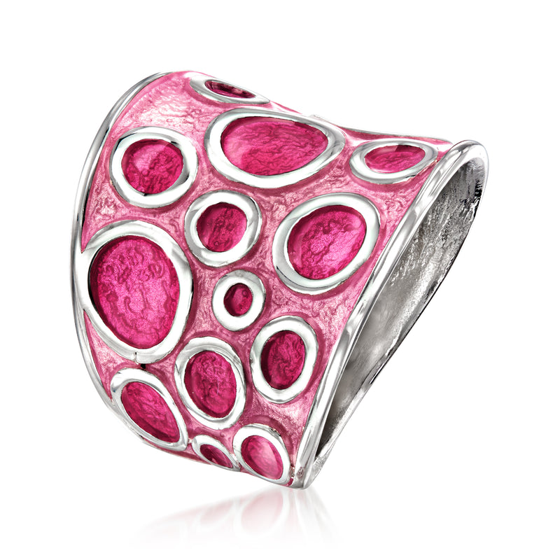 Pink enamel circle-pattern sterling silver ring, angled view, wide domed face