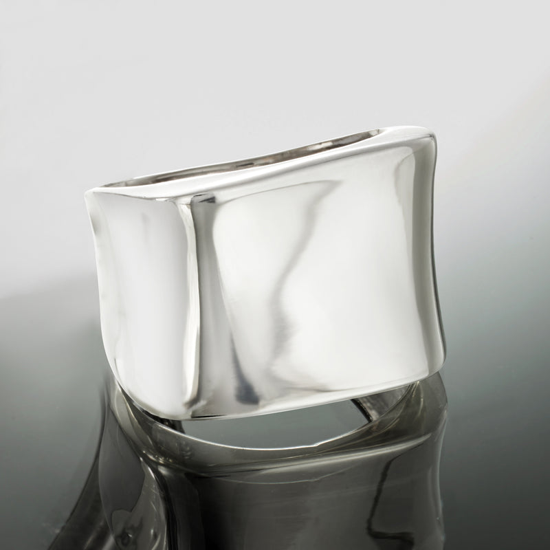 Sterling silver square-top ring with wide band and glossy reflective surface