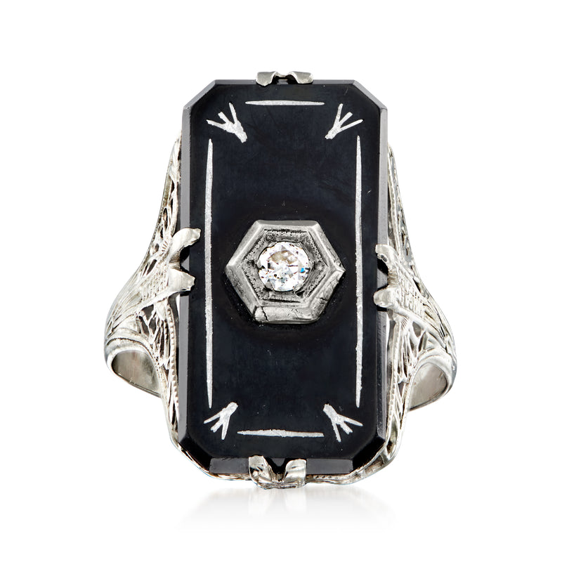 Vintage onyx black enamel ring with single diamond bezel, ornate white gold filigree.